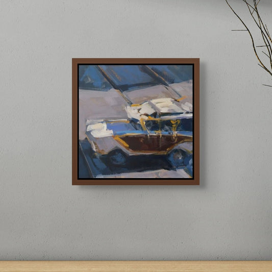 Framed painting of a car on a gray wall