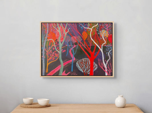 Colorful abstract painting on a gray wall above a wooden console table with decorative items.