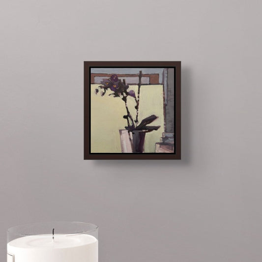 Framed artwork of a still life with flowers on a gray wall.